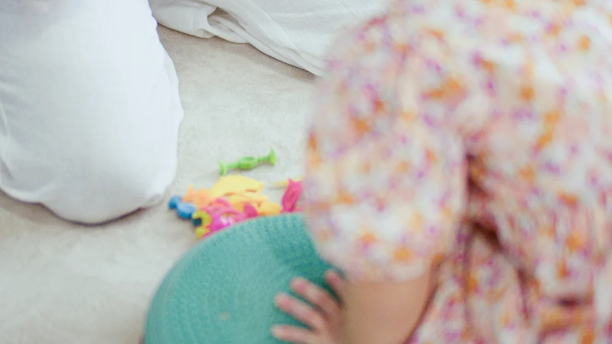 A child playing with sensory toys during a session