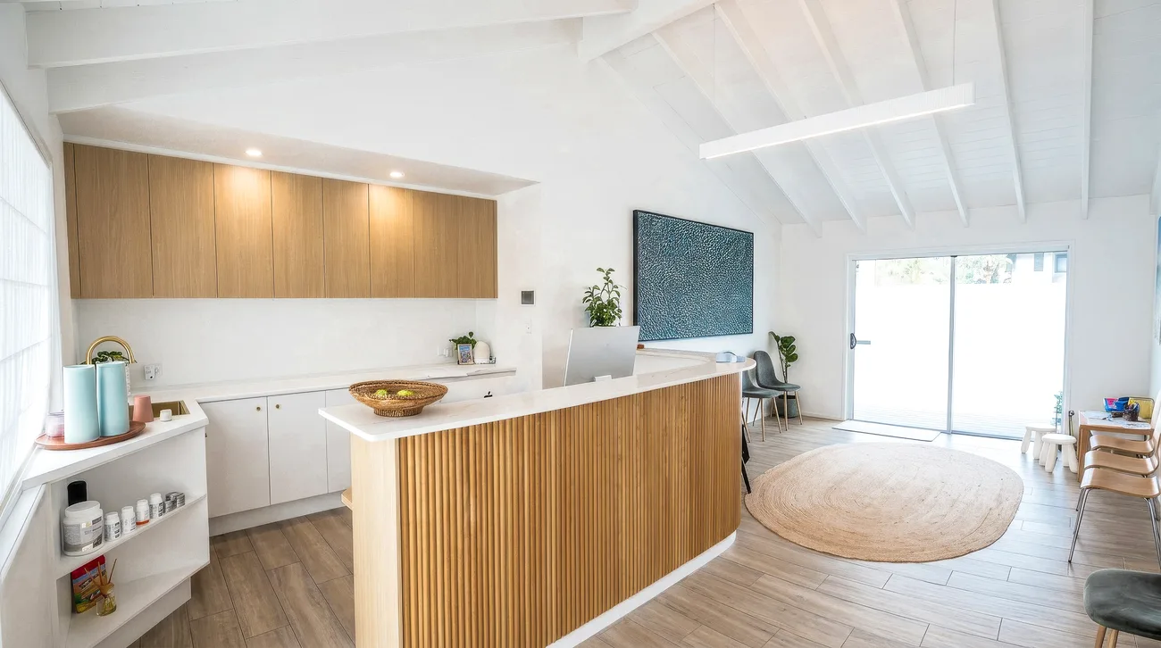 The open, plant-filled Wild Springs practice space with timber reception